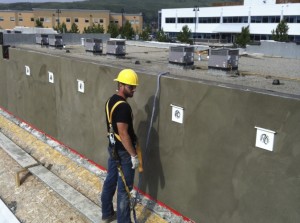 Worker installing stucco